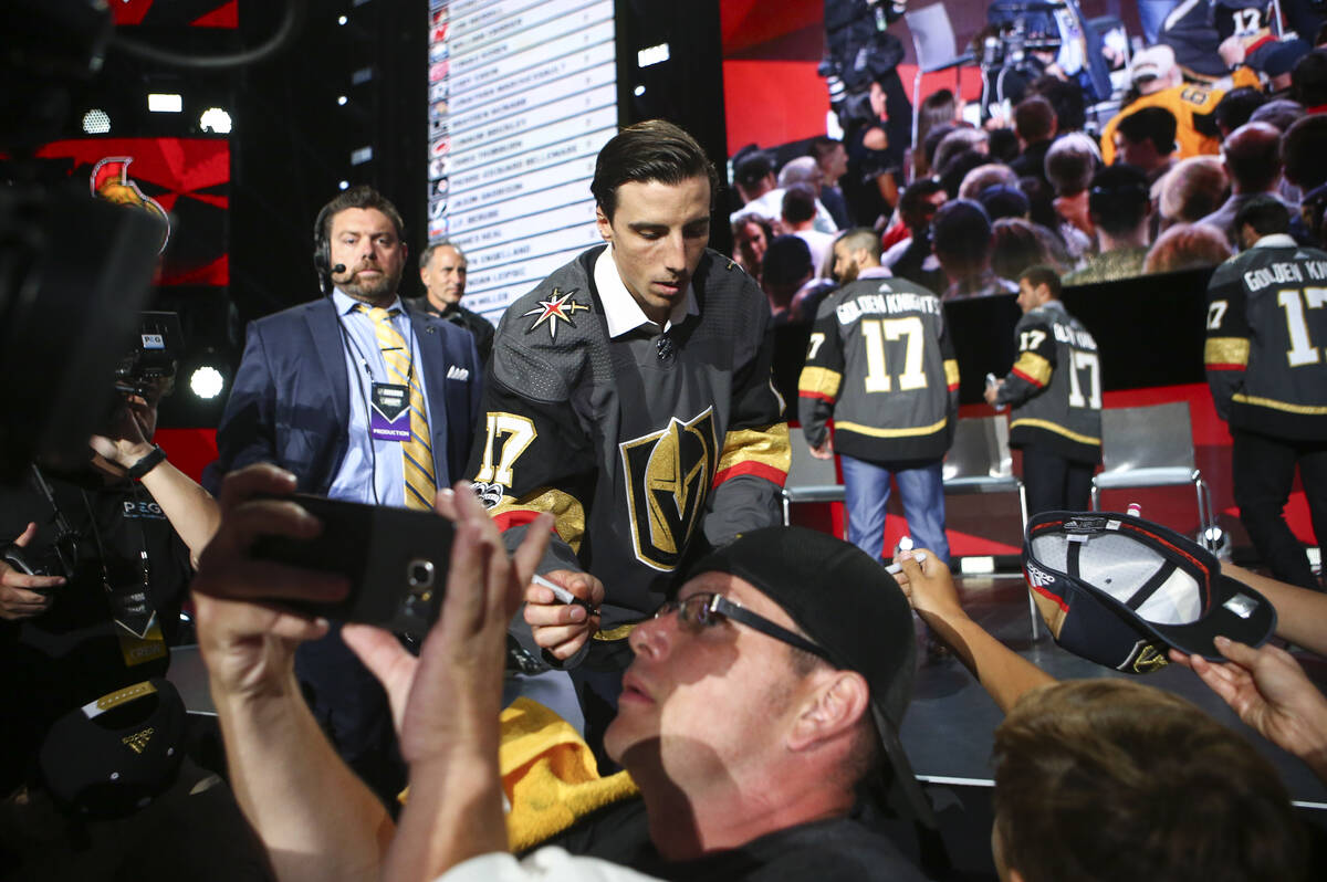 Vegas Golden Knights' Marc-Andre Fleury signs autographs following a roundtable after the NHL A ...
