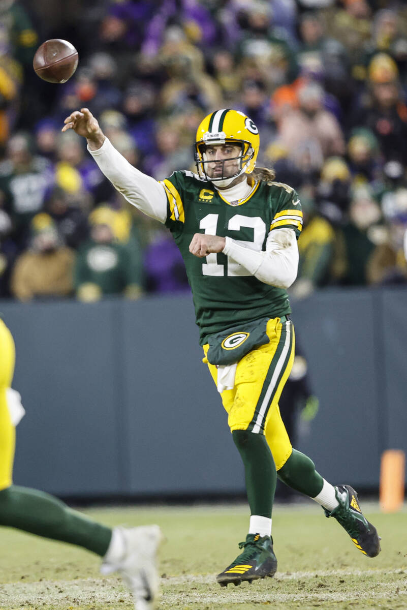 Green Bay Packers quarterback Aaron Rodgers (12) passes the ball during an NFL football game ag ...