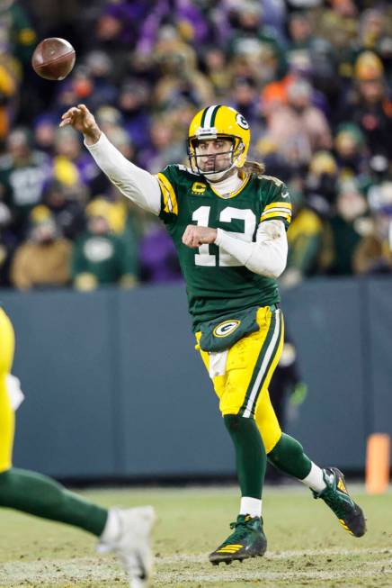 Green Bay Packers quarterback Aaron Rodgers (12) passes the ball during an NFL football game ag ...