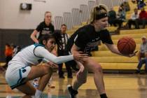 Faith Lutheran HighÕs Raina Forgue (23) drives past Silverado HighÕs Savanna Stokes ( ...