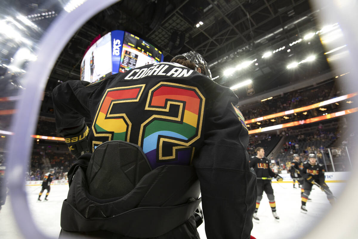 Golden Knights defenseman Dylan Coghlan (52) wears a Pride Knight during warmups before an NHL ...