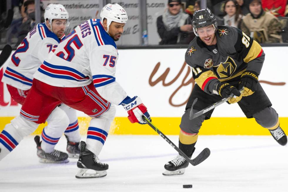 Rangers right wing Ryan Reaves (75) and Golden Knights center Jonathan Marchessault (81) skate ...