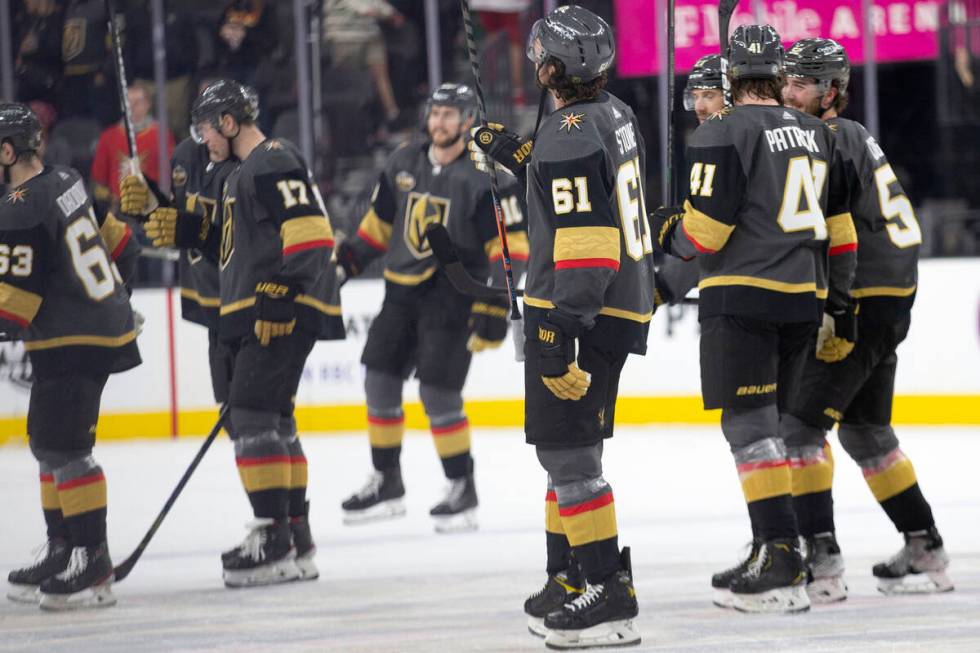 The Golden Knights skate off the ice after winning against the Rangers in an NHL hockey game at ...