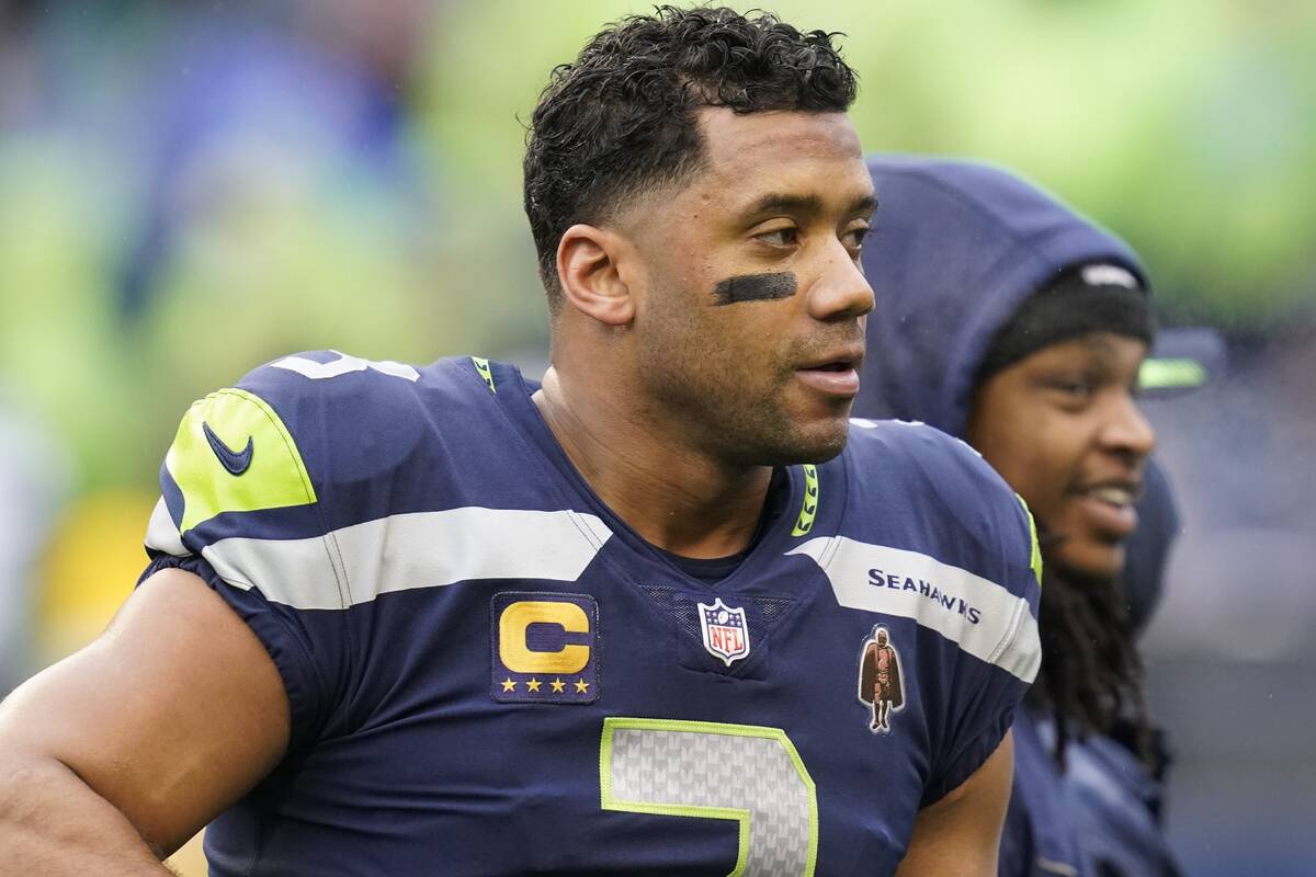 Seattle Seahawks quarterback Russell Wilson warms up before an NFL football game against the De ...