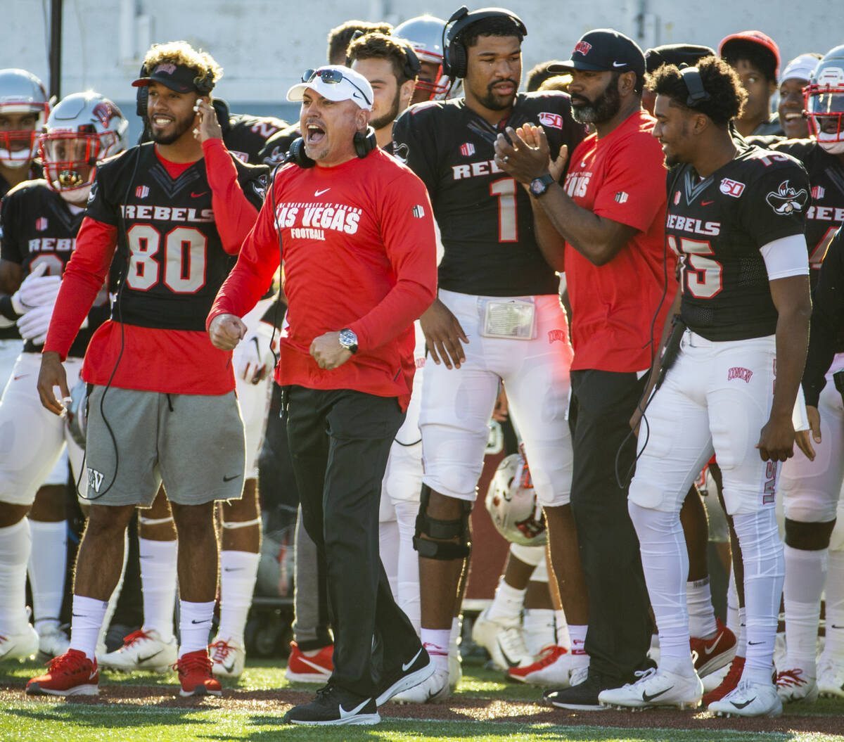 UNLV Rebels head coach Tony Sanchez yells instructions to his players on the sidelines versus t ...