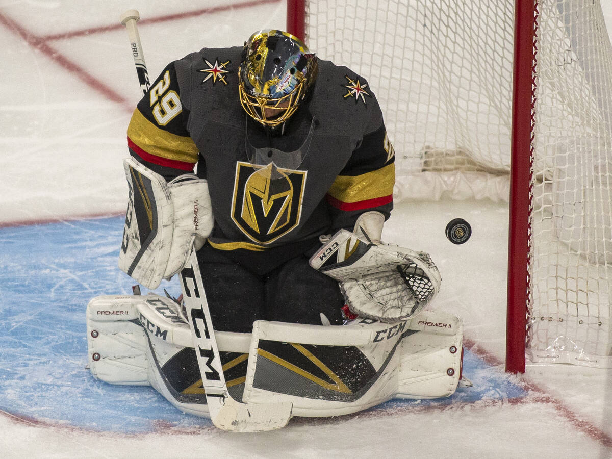 Golden Knights goaltender Marc-Andre Fleury (29) deflects a shot during the first period of Gam ...