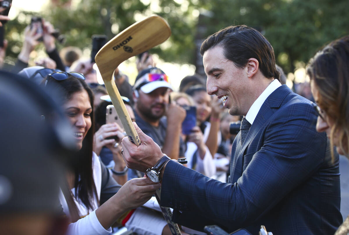 Golden Knights' Marc-Andre Fleury (29) signs autographs on the gold carpet after arriving for t ...