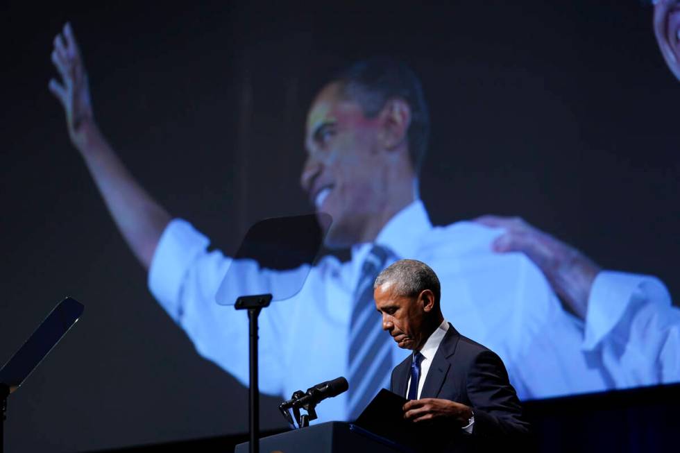 Former President Barack Obama pauses as he speaks during a memorial service for former Senate M ...
