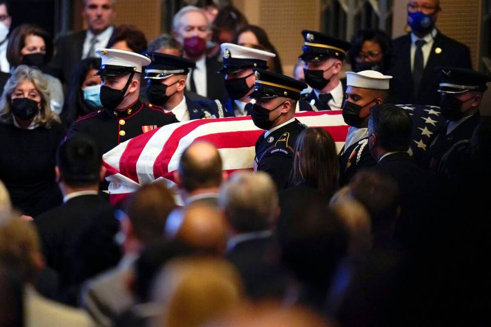 A military honor guard carries the flag-draped casket of former Senate Majority Leader Harry Re ...
