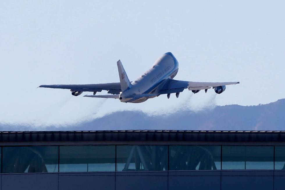Air Force One, carrying President Joe Biden, flies away from Harry Reid International Airport, ...