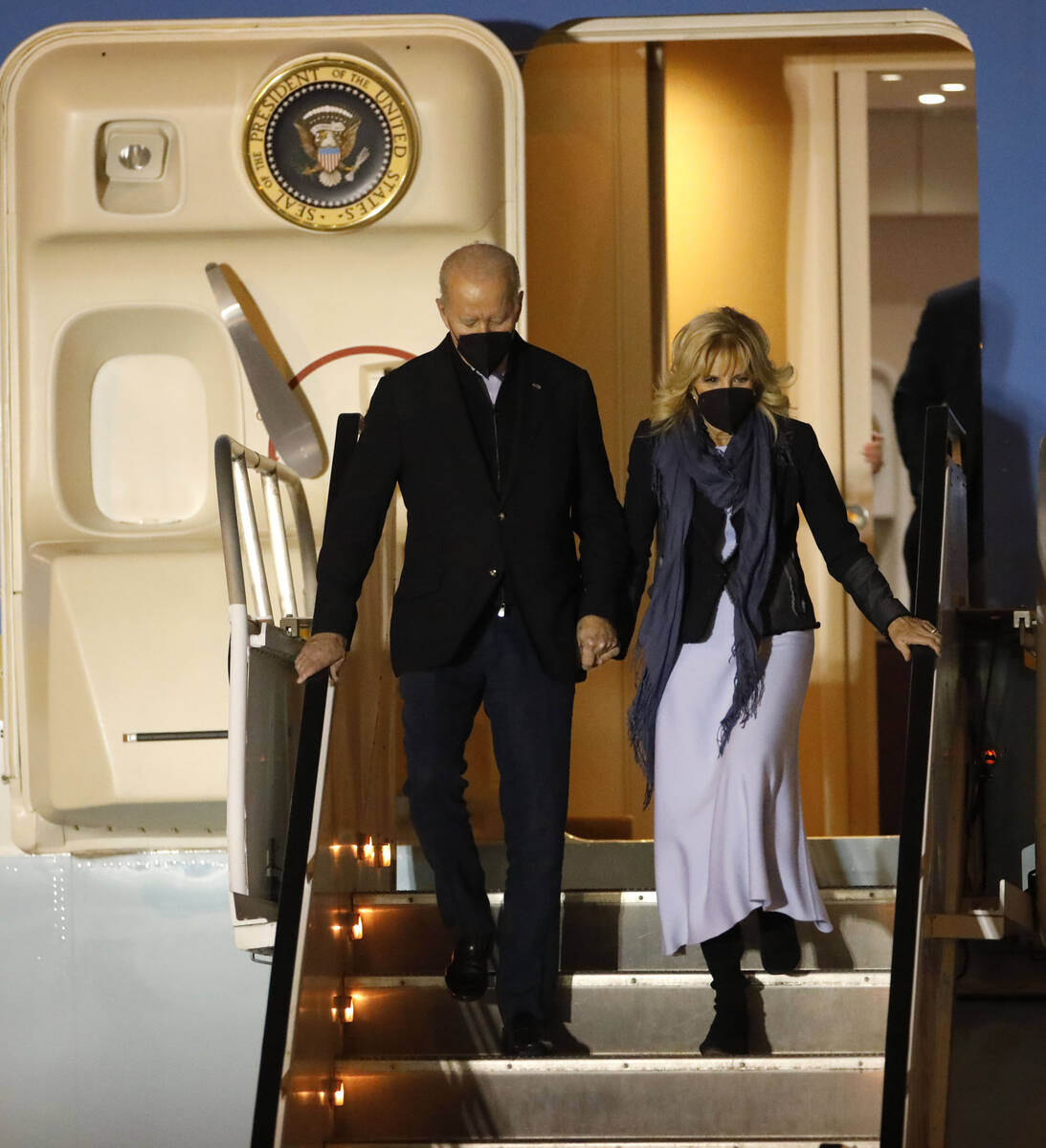 President Joe Biden and first lady Jill Biden walks down the stairs during their arrival on Air ...