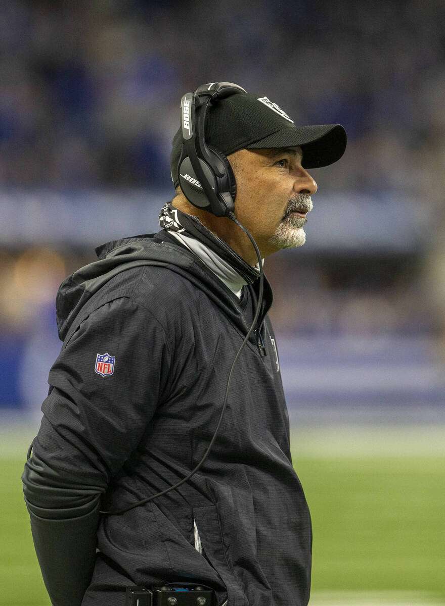 Raiders interim head coach Rich Bisaccia watches the game clock tick down before calling a time ...