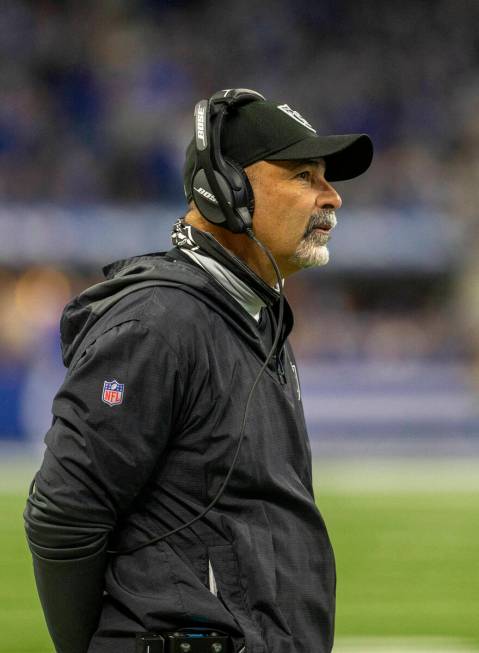 Raiders interim head coach Rich Bisaccia watches the game clock tick down before calling a time ...