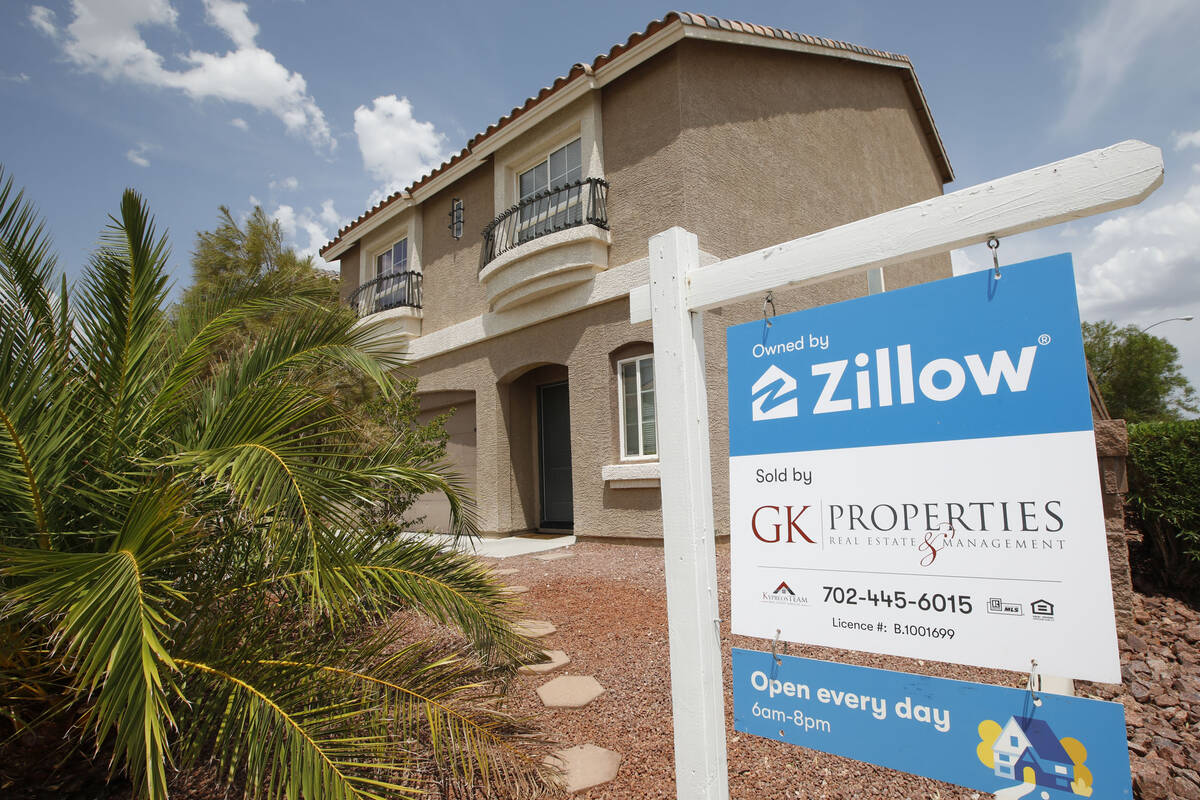 A sale sign is seen in front of a Zillow-owned house at Mills Reef Court in Las Vegas, Friday, ...
