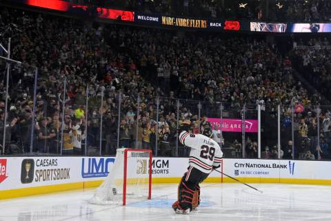 Chicago Blackhawks goaltender Marc-Andre Fleury acknowledges the crowd during a presentation be ...