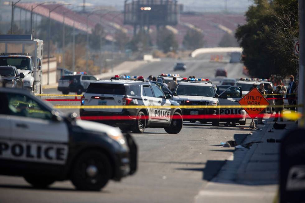 Las Vegas police investigate the scene of an officer-involved shooting near the intersection of ...