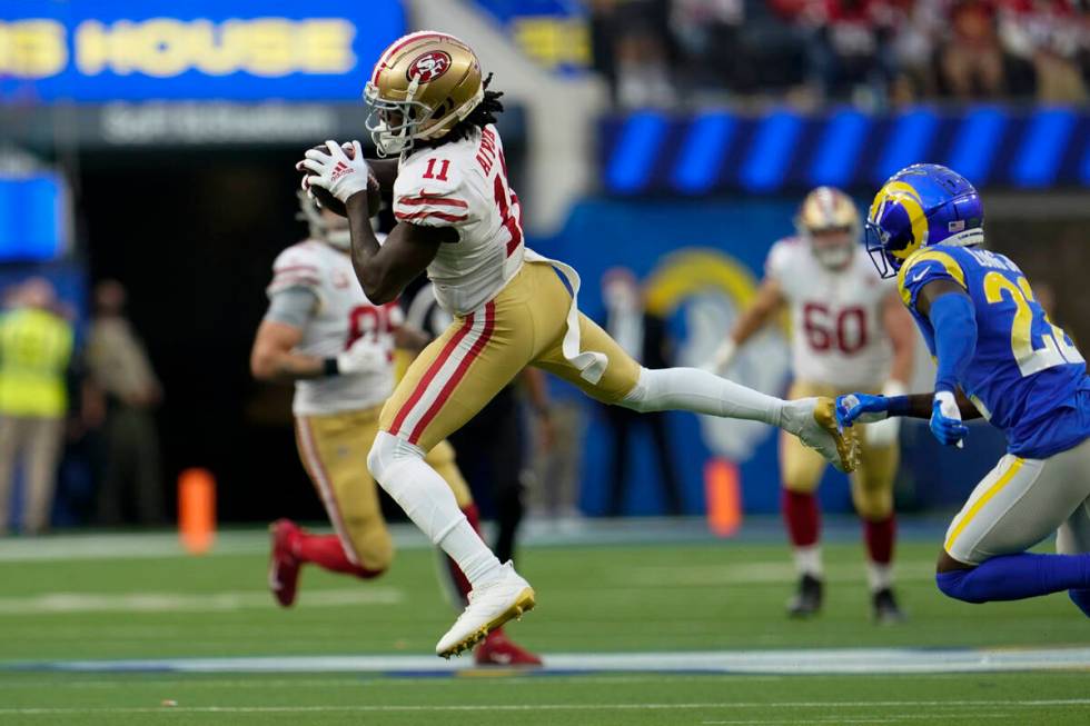 San Francisco 49ers wide receiver Brandon Aiyuk (11) catches a pass during the first half of an ...