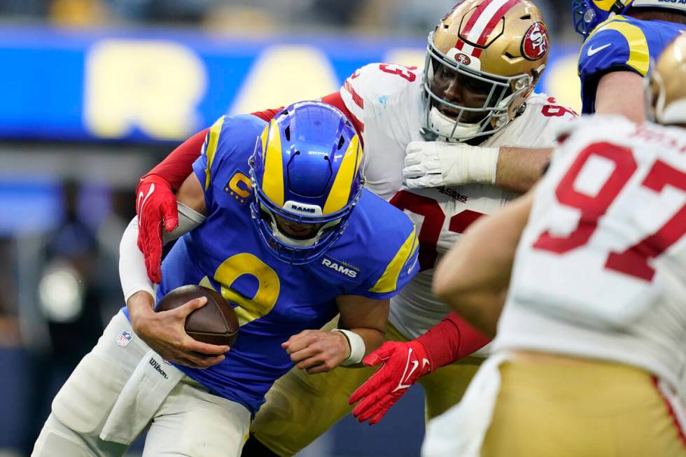 San Francisco 49ers defensive tackle D.J. Jones (93) sacks Los Angeles Rams quarterback Matthew ...