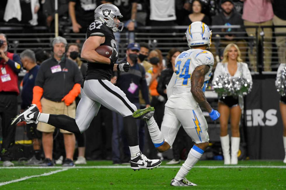 Las Vegas Raiders tight end Foster Moreau (87) runs after making a catch against the Los Angele ...