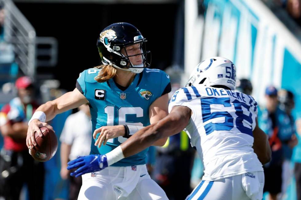 Indianapolis Colts middle linebacker Bobby Okereke (58) puts pressure on Jacksonville Jaguars q ...