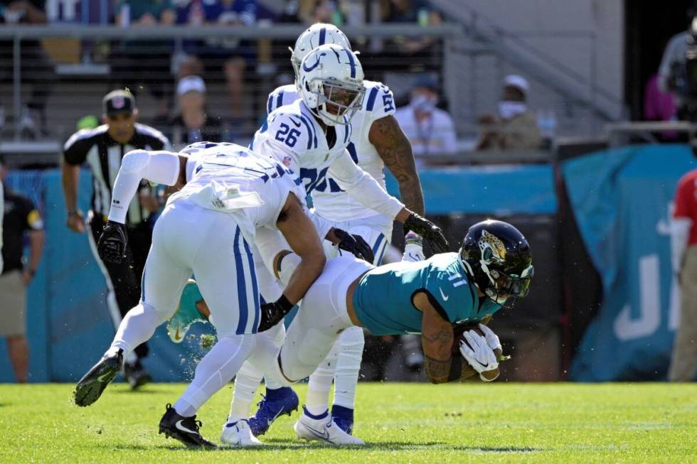 Jacksonville Jaguars wide receiver Marvin Jones (11) is tackled after a reception by Indianapol ...