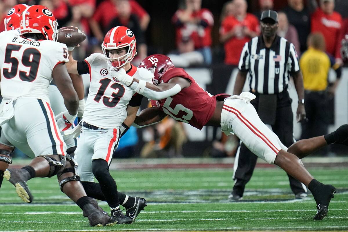 Alabama's Dallas Turner sacks Georgia's Stetson Bennett during the first half of the College Fo ...