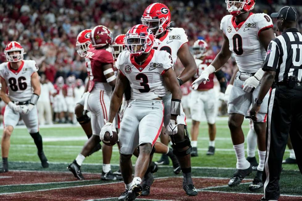 Georgia's Zamir White celebrates after running for a touchdown during the second half of the Co ...