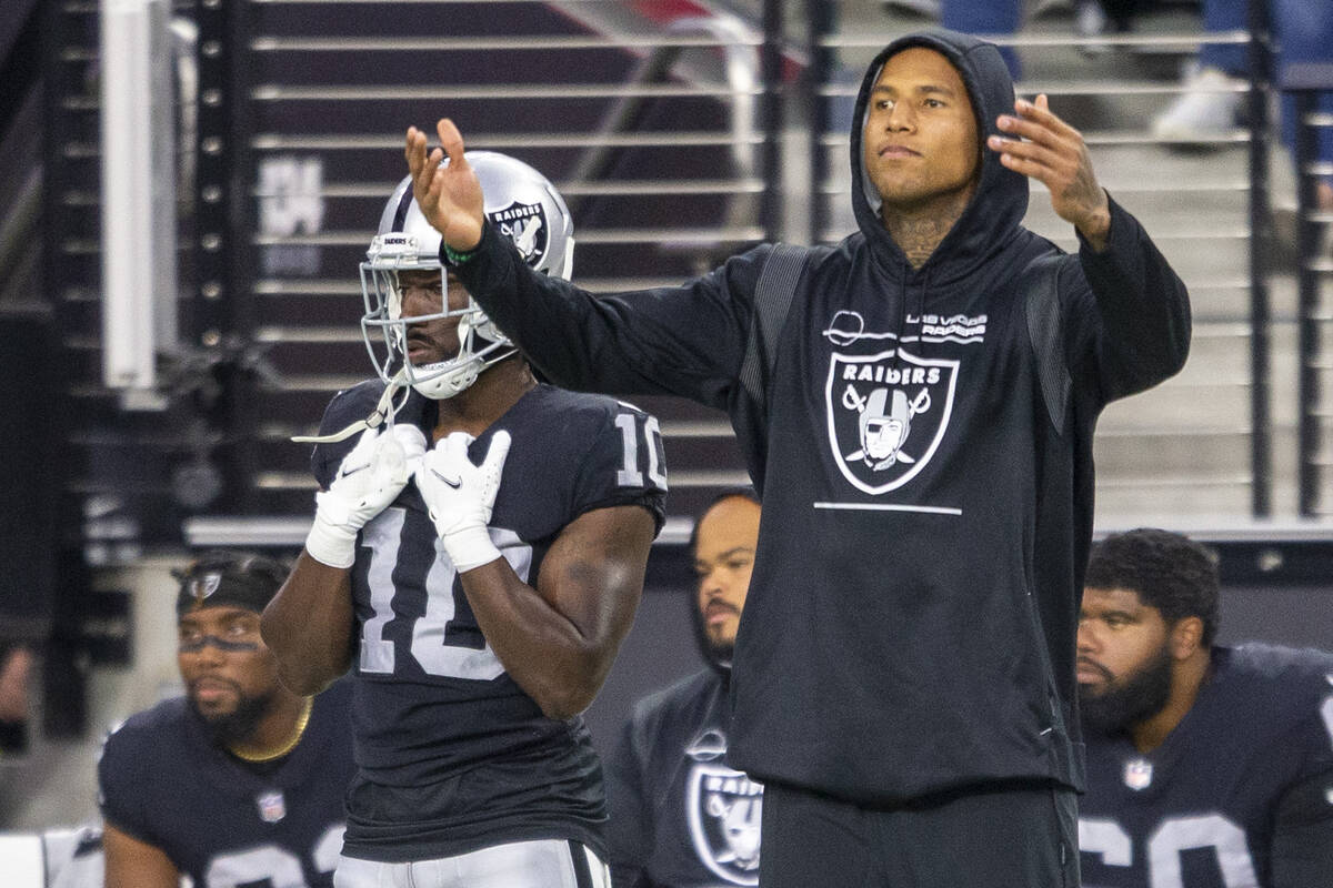 Raiders tight end Darren Waller (83) tries to get the crowd to make noise during the fourth qua ...