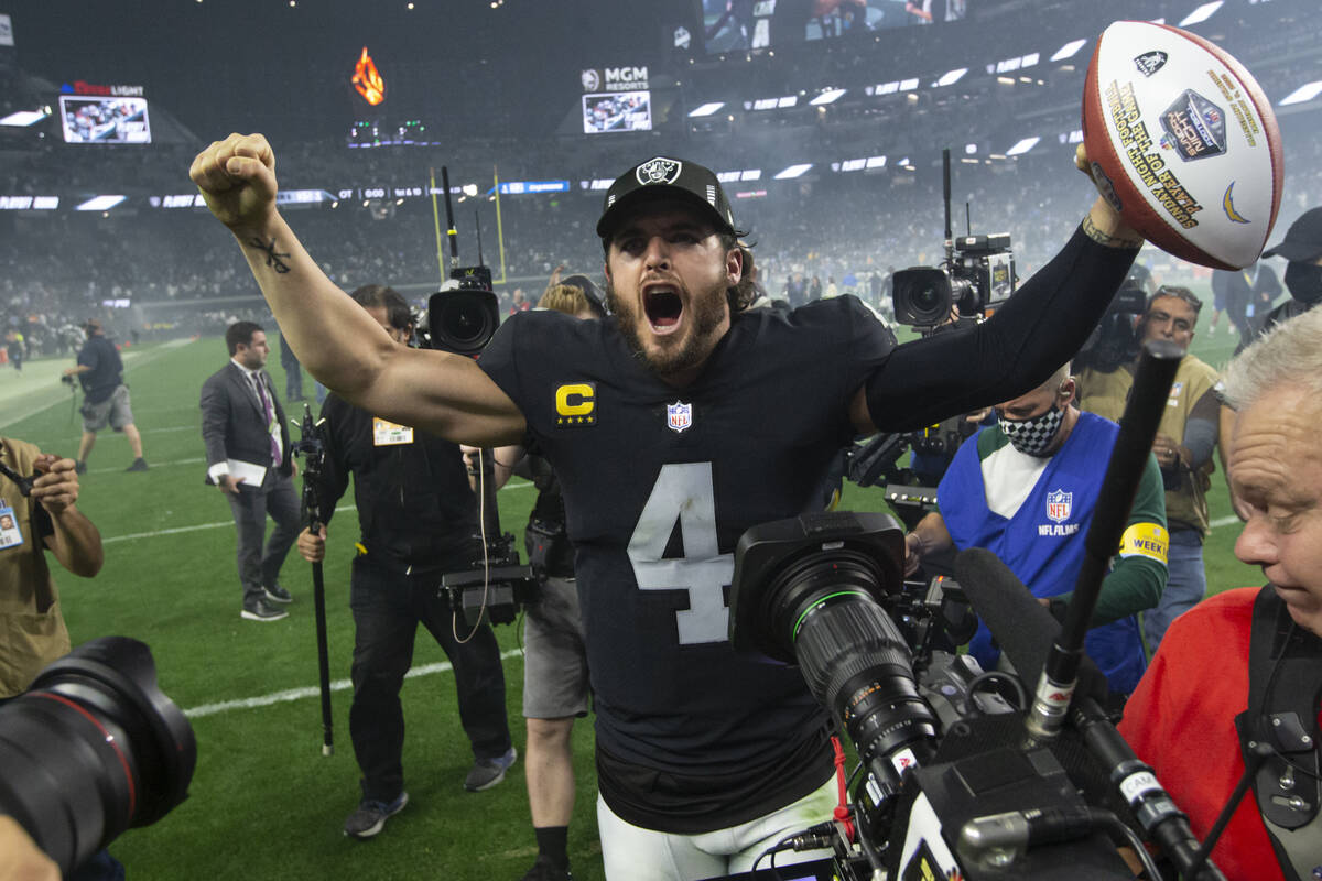 Raiders quarterback Derek Carr celebrates the team’s overtime win against the Los Angele ...