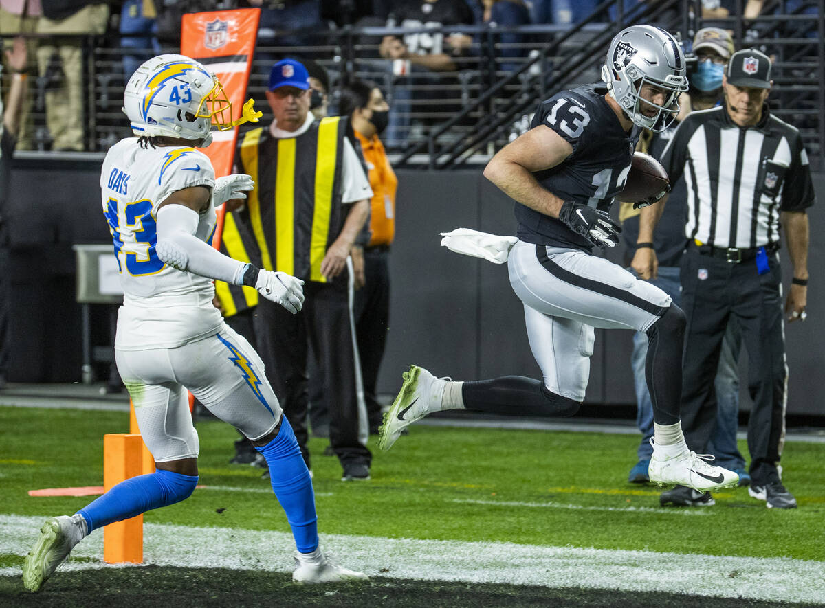Raiders wide receiver Hunter Renfrow (13) leaps into the end zone for a score as Los Angeles Ch ...