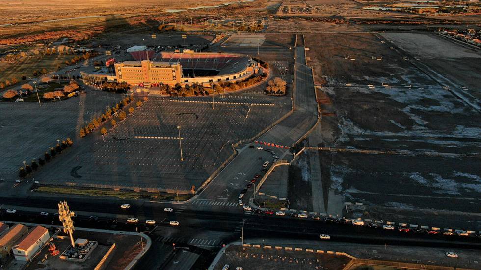 An aerial view of Sam Boyd Stadium as cars line up down South Broadbent Boulevard for the drive ...