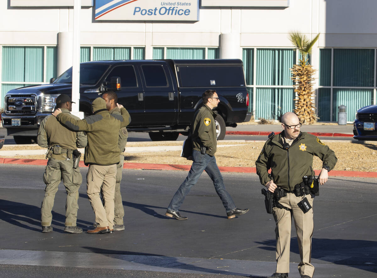 The Las Vegas police officers are congregating in the parking lot of a post office at Nellis Bo ...
