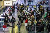 Guests in the ticketing area of Harry Reid International Airport on Monday, Jan. 10, 2022 in La ...