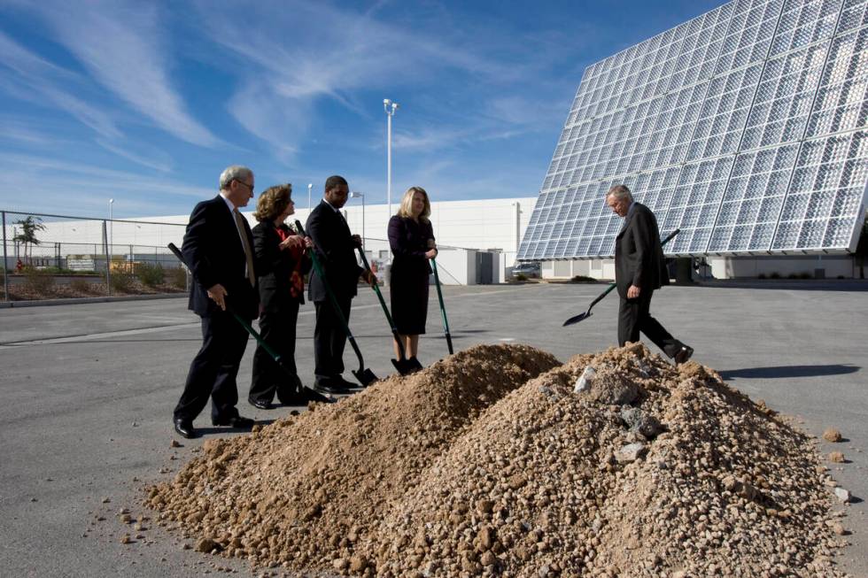 In this Oct. 28, 2010, file photo, Harry Reid, right, walks to participate in a ceremonial grou ...
