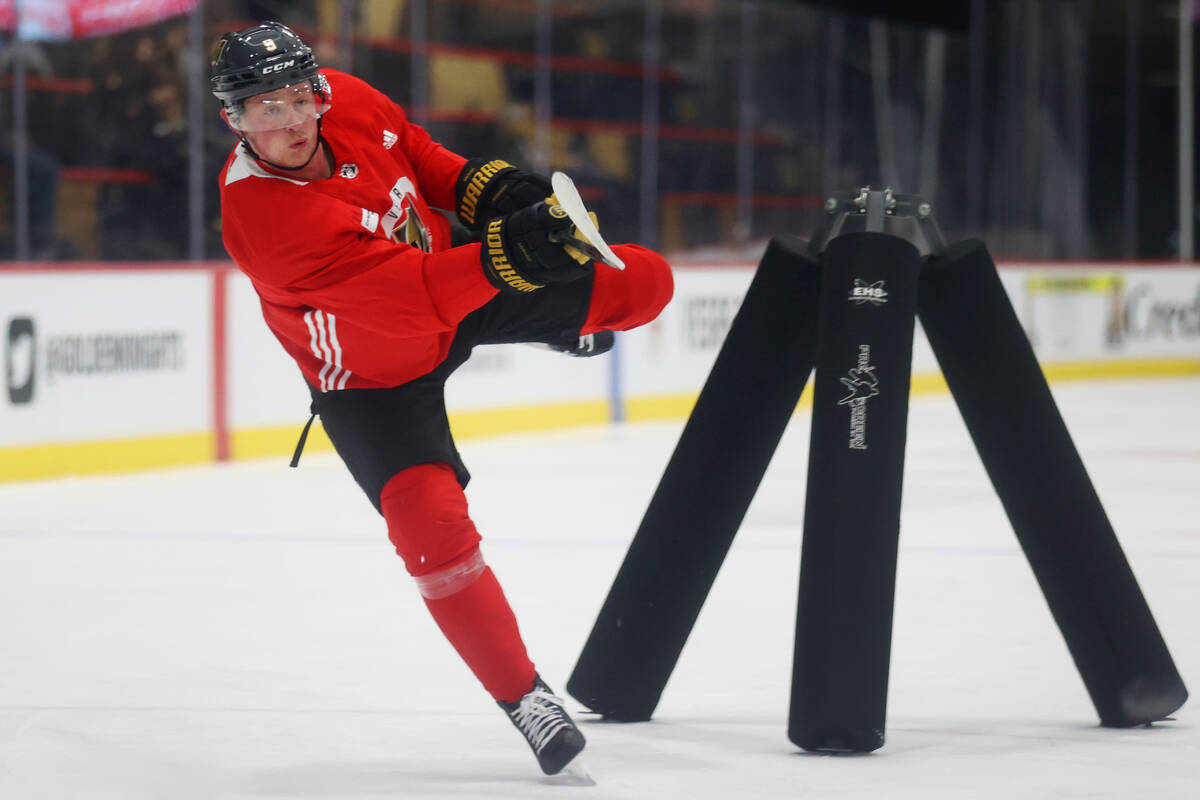 Golden Knights player Jack Eichel takes a shot during a team practice at City National Arena in ...