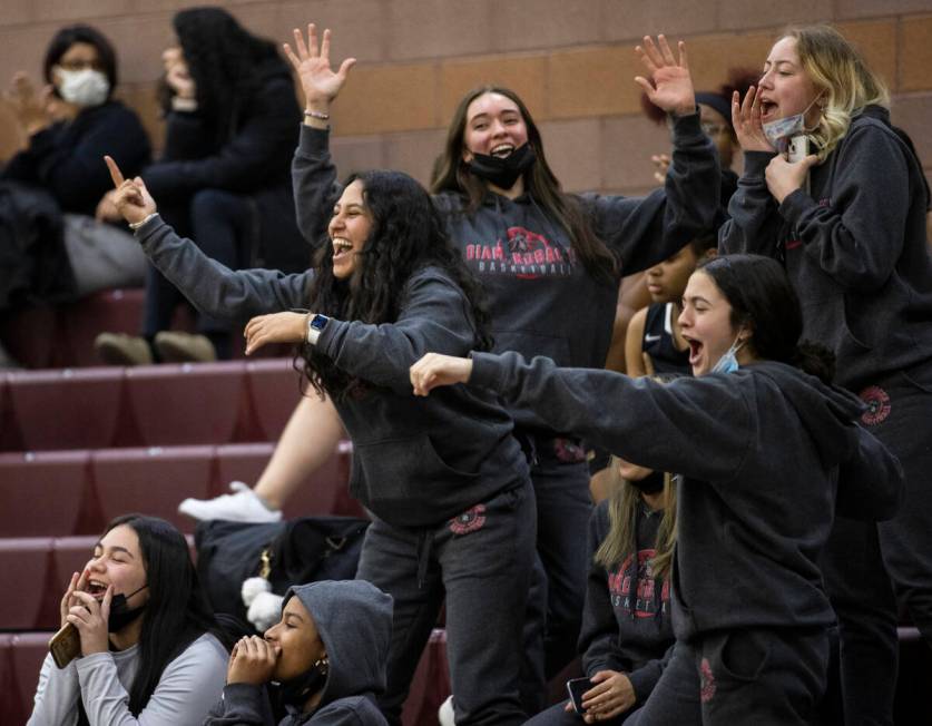 Fans cheer for Desert Oasis in the third quarter during a girls high school basketball game aga ...