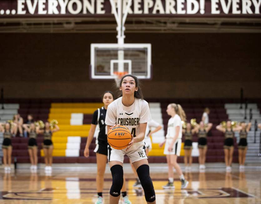 Faith Lutheran’s Leah Mitchell (34) shoots a free throw in the first quarter during a gi ...