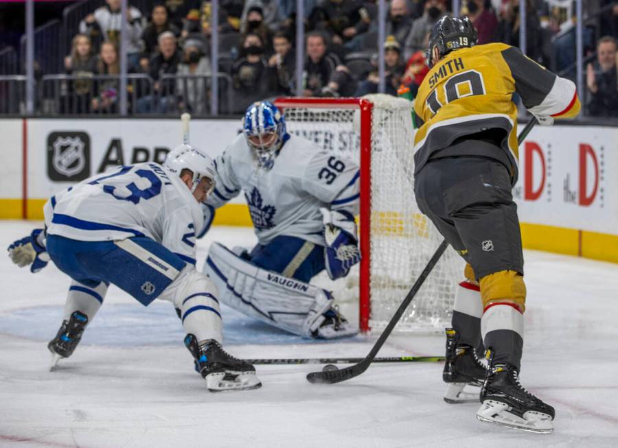 Golden Knights right wing Reilly Smith (19) sets up a shot on Toronto Maple Leafs goaltender Ja ...