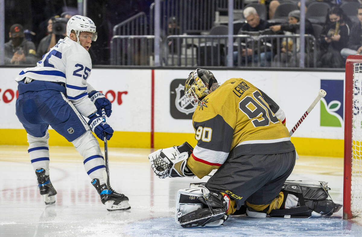 Golden Knights goaltender Robin Lehner (90) grabs a shot on goal by Toronto Maple Leafs right w ...