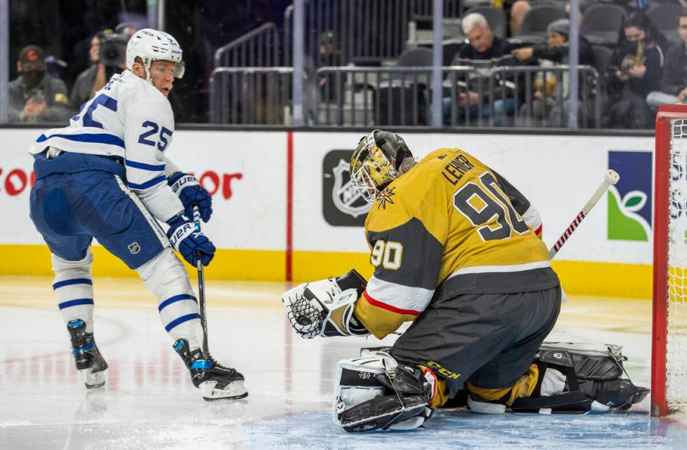 Golden Knights goaltender Robin Lehner (90) grabs a shot on goal by Toronto Maple Leafs right w ...