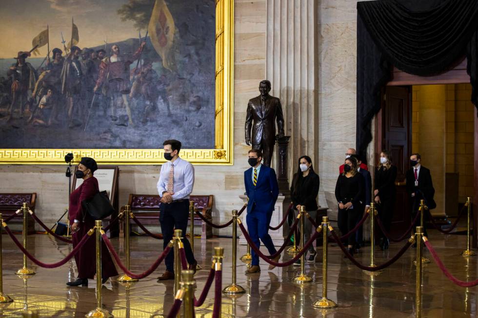 People pay their respects while viewing the flag-draped casket of former Sen. Harry Reid as he ...