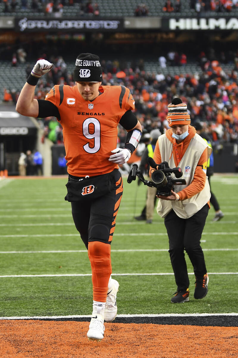 Cincinnati Bengals quarterback Joe Burrow (9) runs off the field after a 34-31 win over the Kan ...