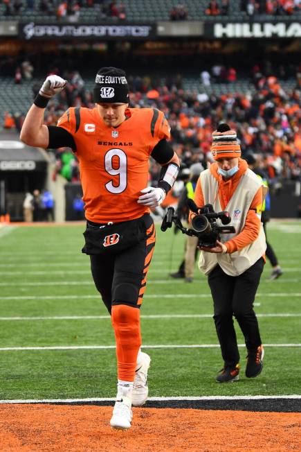 Cincinnati Bengals quarterback Joe Burrow (9) runs off the field after a 34-31 win over the Kan ...