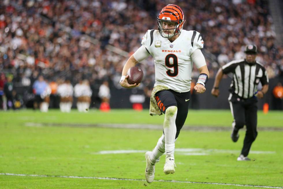 Cincinnati Bengals quarterback Joe Burrow (9) runs the ball against the Las Vegas Raiders durin ...