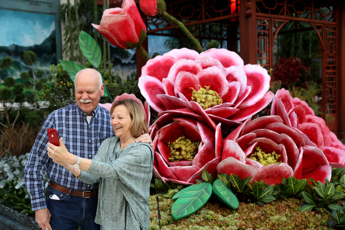 Nancy and Phil Bowen of North Myrtle Beach, N.C. take a selfie in the Lunar New Year display at ...