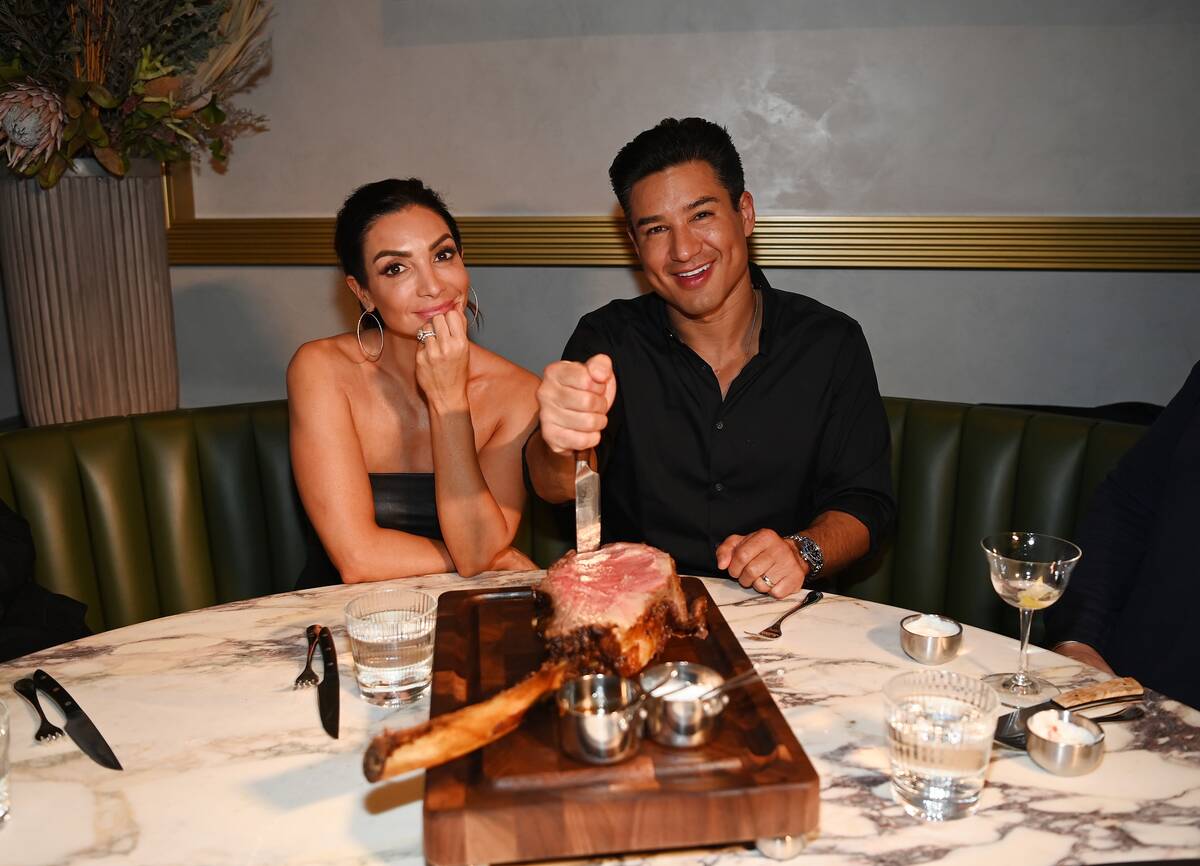 Actress Courtney Mazza and actor Mario Lopez attend the grand opening of Carversteak at Resorts ...