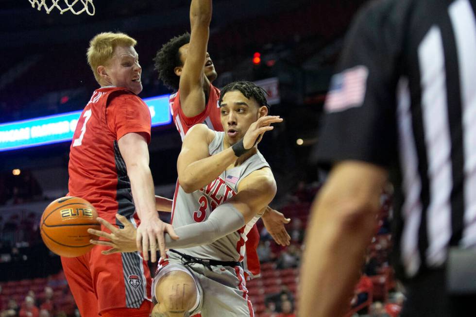 UNLV Rebels guard Marvin Coleman (31) passes down the court while New Mexico Lobos center Sebas ...