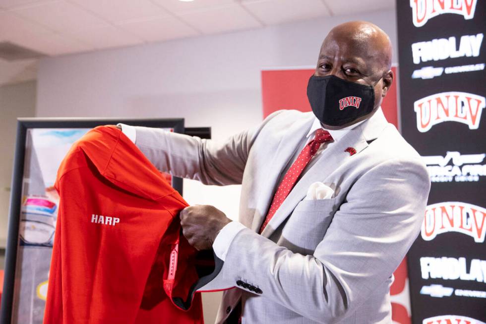 Erick Harper shows his custom gear he received following a press conference announcing him as t ...