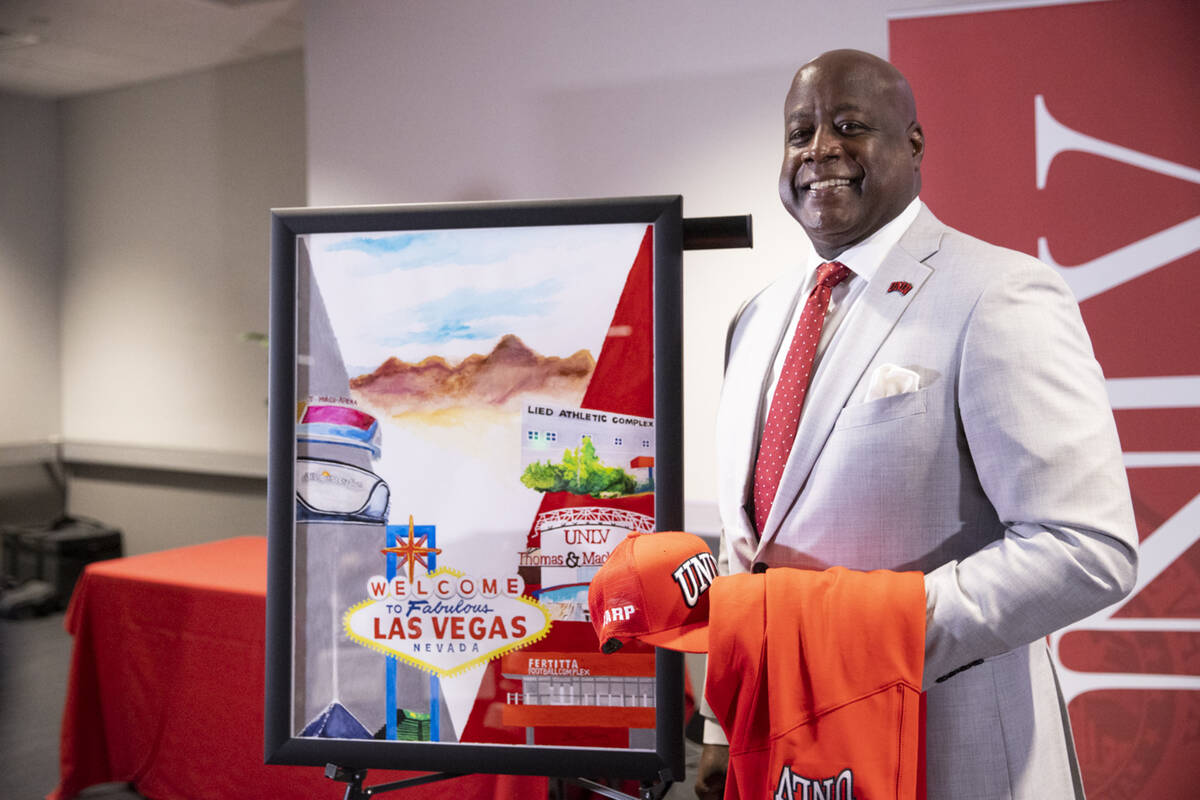 Erick Harper poses for a photo following a press conference announcing him as the new UNLV dire ...