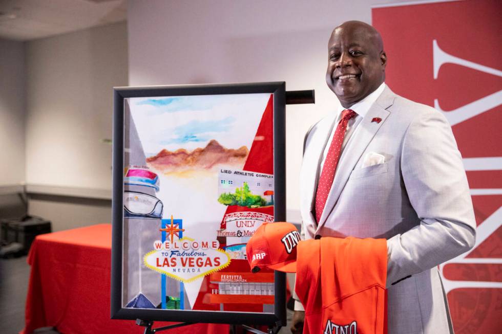 Erick Harper poses for a photo following a press conference announcing him as the new UNLV dire ...